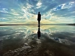 One of British artist Antony Gormley’s life-sized sculptures on Crosby Beach, England. What is the passage of time but a mirror image of what we’re doing with it? (Wikimedia)