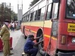 Pune, India - September 10, 2018: PMPML workers try to replace the tyre after the bus was punctured by Bharat Band supporters on Paud road near Kinara hotel in Pune, India, on Monday, September 10, 2018. (Photo by Sanket Wankhade/HT PHOTO) Pune, India - September 10, 2018: PMPML workers try to replace the tyre after the bus was punctured by Bharat Band supporters on Paud road near Kinara hotel in Pune, India, on Monday, September 10, 2018. (Photo by Sanket Wankhade/HT PHOTO)