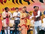 Uttar Pradesh chief minister Yogi Adityanath and his Madhya Pradesh counterpart Mohan Yadav at the inauguration of the epic play ‘Samrat Vikramaditya’, in Varanasi on Friday. (Rajesh Kumar/HT)