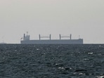 A cargo ship in the Gulf, near the Strait of Hormuz, as seen from northern Ras al-Khaimah, near the border with Oman’s Musandam governance