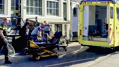 FILE: Medical staff assist one of the five person that were wounded during a stabbing attack in Amsterdam. (AFP)