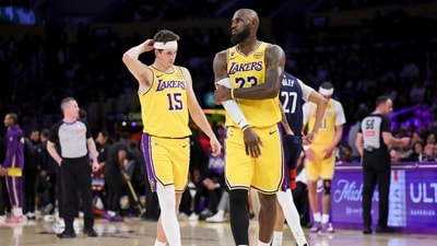 Los Angeles Lakers forward LeBron James, right, and guard Austin Reaves stand during a timeout (AP) Los Angeles Lakers forward LeBron James, right, and guard Austin Reaves stand during a timeout (AP)