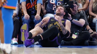 Los Angeles Lakers guard Luka Doncic (77) falls to the court during a play against the Oklahoma City Thunder (IMAGN IMAGES via Reuters Connect)