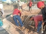 An illegal structure at a residence in Sector 41, Chandigarh, being removed on Saturday. (HT Photo)