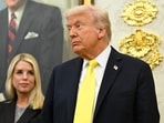 President Donald Trump and former Attorney General Pam Bondi listen as FBI Director Kash Patel speaks during an event 