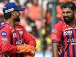 LSG’s Mohammed Shami (R) speaks with captain Rishabh Pant during their match against SRH. (AFP)