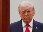 Donald Trump arrives from the Blue Room to speak about the Iran war.
