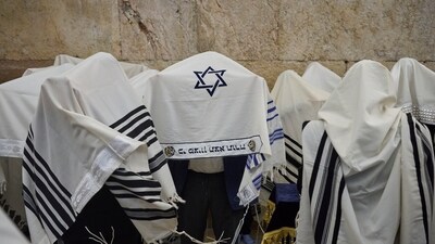 Ultra-Orthodox Jewish men pray during the priestly blessing on the Jewish holiday of Passover at the Western Wall, the holiest site where Jews can pray, in Jerusalem's Old City, largely empty due to restrictions linked to the Iran war, Sunday, April 5, 2026. (AP) Ultra-Orthodox Jewish men pray during the priestly blessing on the Jewish holiday of Passover at the Western Wall, the holiest site where Jews can pray, in Jerusalem's Old City, largely empty due to restrictions linked to the Iran war, Sunday, April 5, 2026. (AP)