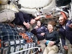 This image taken from video provided by NASA shows the Artemis II crew, from left, Canadian astronaut and mission specialist Jeremy Hansen, Commander Reid Wiseman, mission specialist Christina Koch and pilot Victor Glover as they speak with NASA Mission Control. This image taken from video provided by NASA shows the Artemis II crew, from left, Canadian astronaut and mission specialist Jeremy Hansen, Commander Reid Wiseman, mission specialist Christina Koch and pilot Victor Glover as they speak with NASA Mission Control.