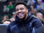 Giannis Antetokounmpo of the Milwaukee Bucks looks on from the bench during the second half of the game against the Memphis Grizzlies.