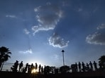 Gram it: Visitors enjoy pleasant weather at the Central Park in Connaught Place on Sunday. But, the India Meteorological Department (IMD), has forecast for rain and thunderstorms today and tomorrow. In fact, a yellow alert has been issued for rain in Delhi on Tuesday.