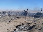 Wreckage is shown at what Iran's state TV claimed was the site of a downed American transport plane and two helicopters involved in a rescue operation, in Isfahan province, Iran, April 2026. 