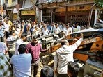 Mumbai, India. April 06, 2026 - After a violent clash between two groups during a local puja in Santosh Nagar, Goregaon, that left one person critically injured, Brihanmumbai Municipal Corporation (BMC) workers demolished the illegal structure belonging to one of the accused. The incident, which occurred Sunday night in Santosh Nagar market area, escalated tensions in the locality. Mumbai, India. April 06, 2026. (photo by Raju Shinde/HT Photo) (Raju Shinde)