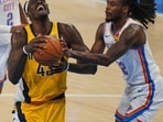 Indiana Pacers forward Pascal Siakam (43) drives as Oklahoma City Thunder guard Cason Wallace defends during the first half of Game 5 of the NBA Finals basketball series.