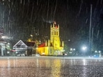 Shimla: People take cover during a hailstorm and rain at the Ridge, in Shimla, Himachal Pradesh, Saturday, April 4, 2026. 