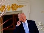 U.S. President Donald Trump gestures, as he heads back to the Oval Office, on the day of the 2026 White House Easter Egg Roll, in Washington, D.C., U.S.