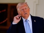 U.S. President Donald Trump gestures, as he heads back to the Oval Office, on the day of the 2026 White House Easter Egg Roll, in Washington, D.C., U.S., April 6, 2026. REUTERS/Nathan Howard