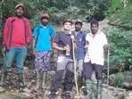 Sharanya (centre) arrived alone from Kerala on Thursday and was staying at a homestay in Kakkabbe village, about 10 km from Napoklu. Seen here in photo with her rescuers.