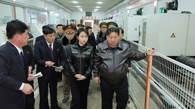 North Korean leader Kim Jong Un, accompanied by his daughter Kim Ju Ae, visits a munitions factory in Pyongyang. (via REUTERS)