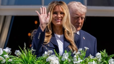 US First Lady Melania Trump, left, and President Donald Trump on the Blue Room balcony during the Easter Egg Roll on the South Lawn of the White House in Washington, DC, US, on Monday, April 6, 2026. (Bloomberg) US First Lady Melania Trump, left, and President Donald Trump on the Blue Room balcony during the Easter Egg Roll on the South Lawn of the White House in Washington, DC, US, on Monday, April 6, 2026. (Bloomberg)