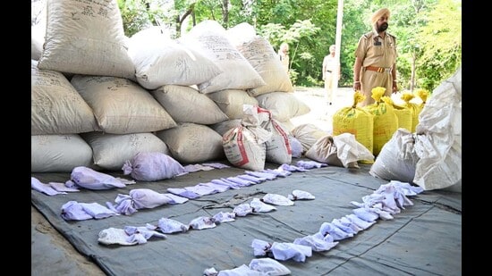 The seized contraband includes poppy husk, heroin, ganja, ice drug and intoxicant tablets. (HT Photo)