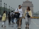 Gram it: What's rain without a reason to walk at the scenic Kartavya Path. Here are some pedestrians doing exactly that as Tuesday witnessed a fresh spell of rain amid yellow alert for thunderstorms and gusty winds in the NCR. 