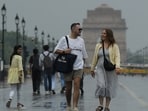 Here are some pedestrians on Kartavya Path on Tuesday as Delhi received a fresh spell of rain amid yellow alert for thunderstorms and gusty winds in the NCR. 