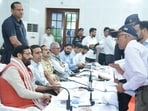 CM Saini addressing locals’ grievances during the redressal meeting at John Hall, in Gurugram on Monday. (HT Photo)