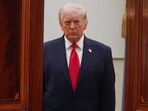 President Donald Trump arrives to speak at a televised address on the conflict in the Middle East from the Cross Hall of the White House.