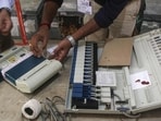 Election officials check EVMs inside a strong room in North Tripura district. (PTI) Election officials check EVMs inside a strong room in North Tripura district. (PTI)