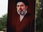A man holds a poster of Iran's new Supreme Leader, Mojtaba Khamenei, during a solidarity rally in support of Iran and against Israel and the United States.