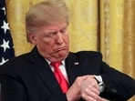US. President Donald Trump checks his watch during an event at the White House in Washington, D.C., U.S.,