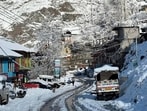 Roads covered in white blanket after snowfall in Lahaul-Spiti district on Monday. (HT Photo)