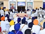 SGPC president Harjinder Singh Dhami addressing the panthic gathering organized at its headquarters Teja Singh Samundri Hall to deliberate the proposed law concerning sacrilege of Guru Granth Sahib on Monday. (HT) SGPC president Harjinder Singh Dhami addressing the panthic gathering organized at its headquarters Teja Singh Samundri Hall to deliberate the proposed law concerning sacrilege of Guru Granth Sahib on Monday. (HT)