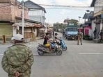 Security personnel stand guard in violence-hit Manipur. (ANI)