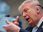 US President Donald Trump mimics firing a gun as he speaks about the conflict in Iran in the James S. Brady Press Briefing Room of the White House on April 6, 2026, in Washington, DC.