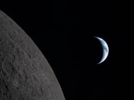 This handout picture released on April 7, 2026, by NASA shows Earth drawing closer to passing behind the Moon, about six minutes before "Earthset," as seen from the Orion spacecraft on April 6, 2026. The Artemis II astronauts wrapped up their lunar flyby as they continue their journey back to Earth on Tuesday, bringing with them rich celestial observations including little-known lunar craters, a solar eclipse and meteor strikes that scientists hope will open doors. (Photo by Handout / NASA / AFP) / RESTRICTED TO EDITORIAL USE - MANDATORY CREDIT "AFP PHOTO / NASA" - HANDOUT - NO MARKETING NO ADVERTISING CAMPAIGNS - DISTRIBUTED AS A SERVICE TO CLIENTS This handout picture released on April 7, 2026, by NASA shows Earth drawing closer to passing behind the Moon, about six minutes before "Earthset," as seen from the Orion spacecraft on April 6, 2026. The Artemis II astronauts wrapped up their lunar flyby as they continue their journey back to Earth on Tuesday, bringing with them rich celestial observations including little-known lunar craters, a solar eclipse and meteor strikes that scientists hope will open doors. (Photo by Handout / NASA / AFP) / RESTRICTED TO EDITORIAL USE - MANDATORY CREDIT "AFP PHOTO / NASA" - HANDOUT - NO MARKETING NO ADVERTISING CAMPAIGNS - DISTRIBUTED AS A SERVICE TO CLIENTS