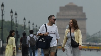 Here are some pedestrians on Kartavya Path on Tuesday as Delhi received a fresh spell of rain amid yellow alert for thunderstorms and gusty winds in the NCR. (Photo: Naveen Sharma/ANI) Here are some pedestrians on Kartavya Path on Tuesday as Delhi received a fresh spell of rain amid yellow alert for thunderstorms and gusty winds in the NCR. (Photo: Naveen Sharma/ANI)