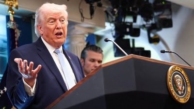 President Donald Trump, flanked by Secretary of Defense Pete Hegseth, speaks during a press conference (REUTERS)