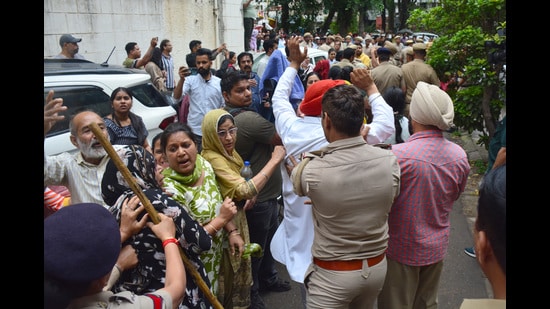 Residents protesting against Chandigarh housing board demolition drive in sector 45. (Ravi Kumar)