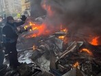 US-Iran war LIVE: A rescue worker extinguishes burning cars at the site of an Israeli airstrike in central Beirut, Lebanon, Wednesday, April 8, 2026.