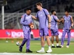 Sunil Narine and Cameron Green during warm-up before a match.