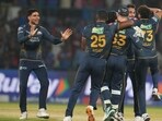 Gujarat Titans celebrate after they won against Delhi Capitals in New Delhi on Wednesday. (AP)