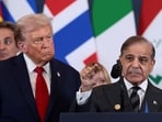US President Donald Trump looks at Pakistan's Prime Minister Shehbaz Sharif speaking following the official signing of the first phase of the Gaza ceasefire agreement between Israel and Hamas, during a world leaders' summit on ending the Gaza war, in Sharm El-Sheikh, Egypt.