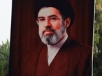 A man holds a poster of Iran's new Supreme Leader, Mojtaba Khamenei, during a solidarity rally in support of Iran and against Israel and the United States.