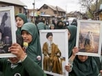 People carrying out a march and raising slogans as they gathered in response to the ceasefire agreement between Iran, the US and Israel, in Pulwama on Wednesday. (PTI Photo)