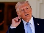 U.S. President Donald Trump gestures, as he heads back to the Oval Office, on the day of the 2026 White House Easter Egg Roll, in Washington, D.C., U.S., April 6, 2026.