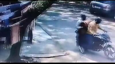 A CCTV video of the incident, accessed by HT, shows two men on a motorbike approach a house in Greater Noida, and after spending about two to three minutes inside, leave with two gas cylinders (Video Grab/HT)