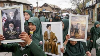 People carrying out a march and raising slogans as they gathered in response to the ceasefire agreement between Iran, the US and Israel, in Pulwama on Wednesday. (PTI Photo) People carrying out a march and raising slogans as they gathered in response to the ceasefire agreement between Iran, the US and Israel, in Pulwama on Wednesday. (PTI Photo)