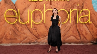 Maude Apatow, who plays Lexi in the show, stepped out in a chic, minimalist black ensemble featuring a sleeveless, asymmetrical top paired with a high-waisted, voluminous midi skirt (with pockets!). The structured silhouette was elevated with subtle draping and paired with strappy black heels. (REUTERS)